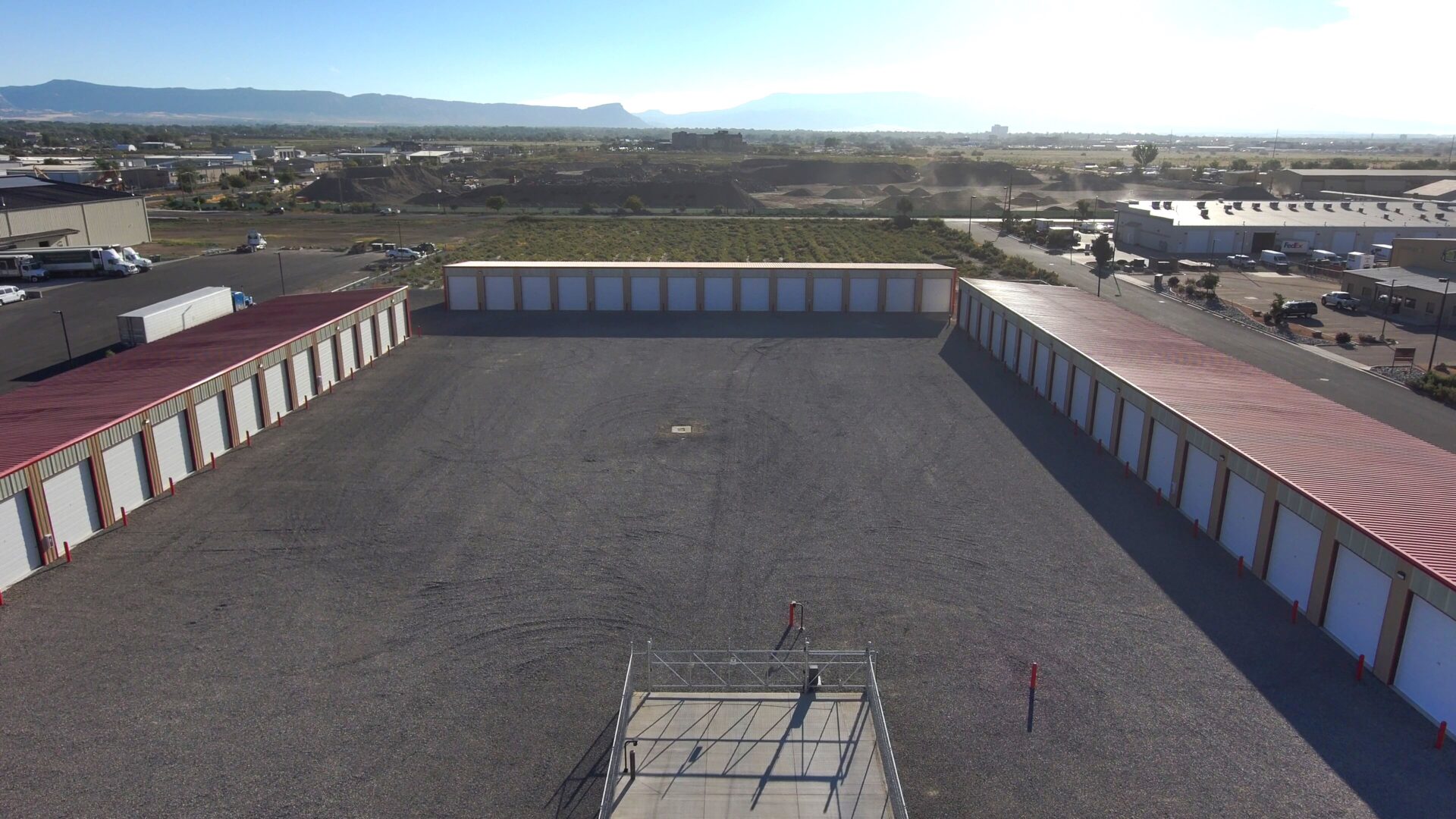 A large open lot with many storage buildings.